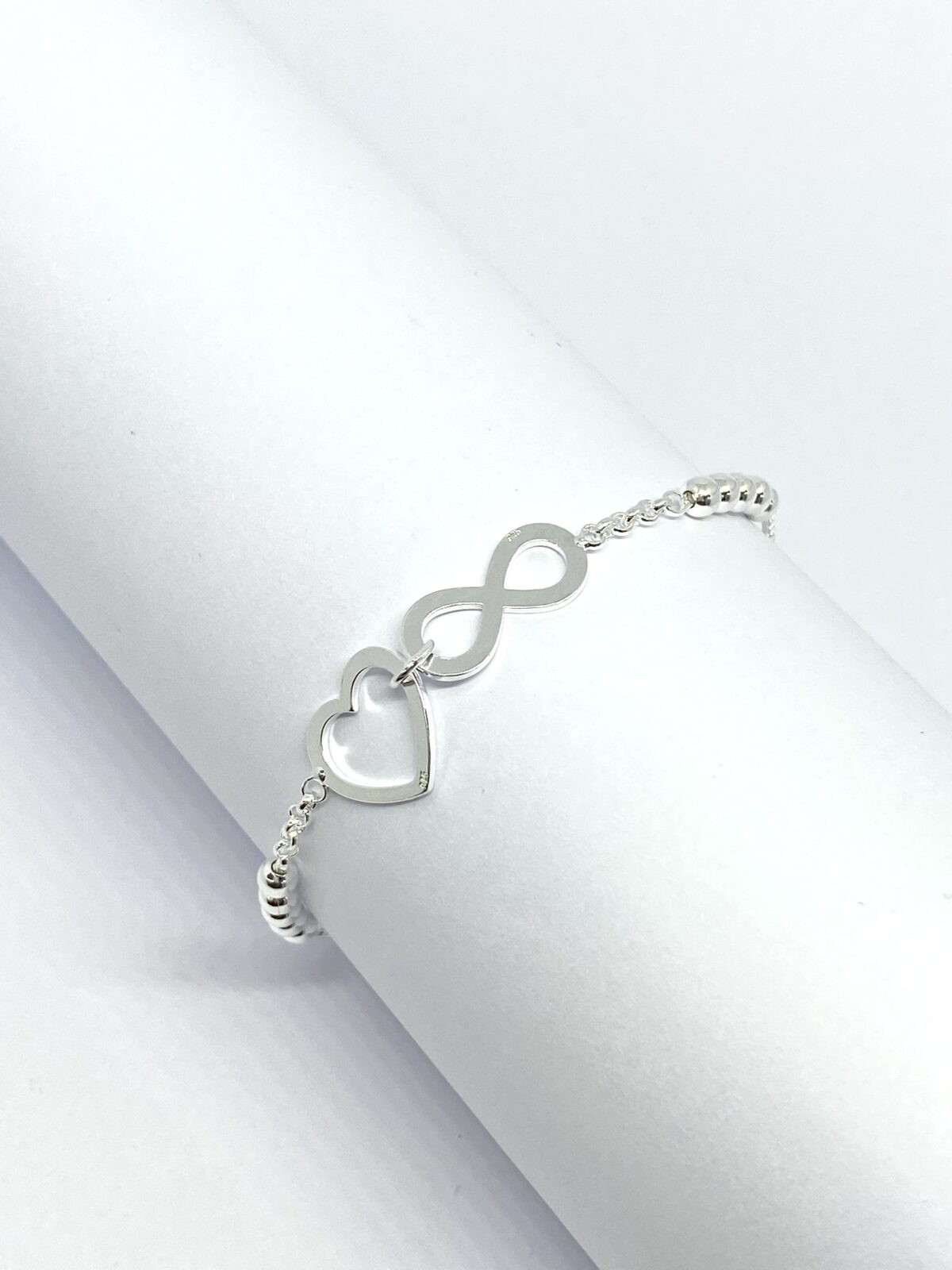 Pulsera de Plata 9.25 con Diseño de Corazón, Infinito y Bolas Regulable SoleJoyas Pulsera de Plata 9.25 con Diseño de Corazón, Infinito y Bolas Regulable - Imagen 1